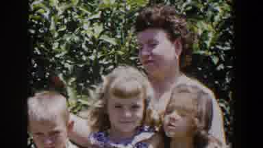 Lubbock Texas (1953): A Woman Pets Her Three Children As They Wait For The Train