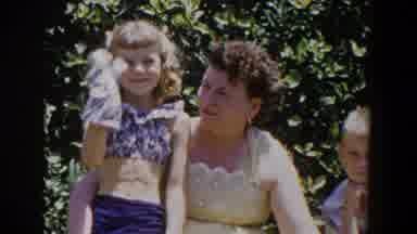 Lubbock Texas (1953): Young Girl Plays With Her Hand Puppet As Mother Looks On