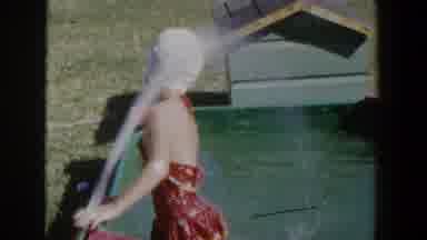 Lubbock Texas (1953): Girl Child Wearing Swimsuit And Cap Is Sprayed By Water In