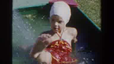 Lubbock Texas (1953): A Girl Enjoys Washes Herself With Water Gushing Out Of A