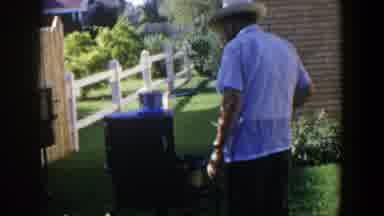 Lubbock Texas (1953): A Farmer Wearing A Hat Working On His Garden Looking