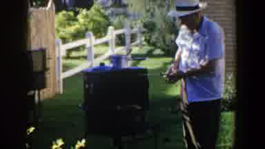Lubbock Texas (1953): A Man In A Hat Checking His Plants In The Farm On A Sunny