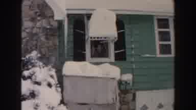 Dearborn Michigan (1961): Person In The Window Waving For The Cameraman While Is