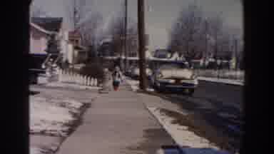Dearborn Michigan (1961): A Little Boy With Some Red Boots Walking Over The