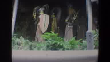 Walt Disney World Florida (1973): People Wearing Blue And Orange Costumes Stand