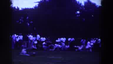 Ridgefield New Jersey-1961: Large Crowd Gathering In Field Near Trees On A Cloudy Day