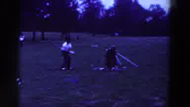 Ridgefield New Jersey (1961): Man Wearing Brown Pants Swings Golf Club On A Clear