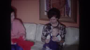 North Hollywood California (1961): Two Women Play With A Baby On The Couch In The