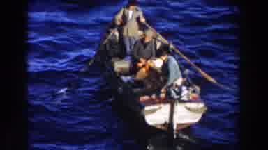 GIBRALTAR-1959: Three Men Rowing A Small Boat On Rough Waters