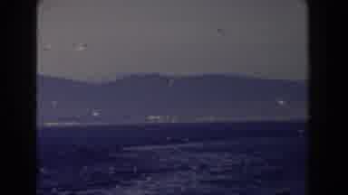 Gibraltar (1959): View Of Grey Buildings At Base Of Mountain On A Hazy Day