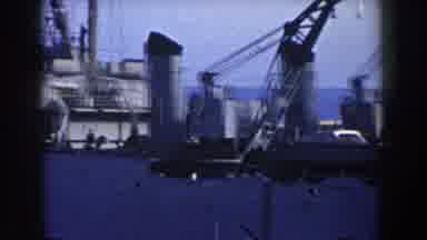 GIBRALTAR-1959: Brown And White Tugboat Sails Next Grey Ship On A Clear Day