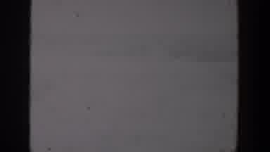 Lubbock Texas (1957): A Group Of People Walking Together In A Crowd Around A