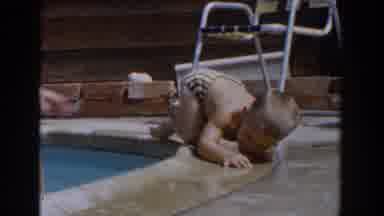 Van Nuys California-1962: Baby Crawls At Pool Edge As Mother Guides Him