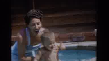 Van Nuys California (1962): Woman Wearing White Swimwear Dunks Toddler In Pool