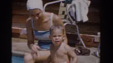Van Nuys California (1962): A Mother Trying To Get Her Young Son Into The Pool