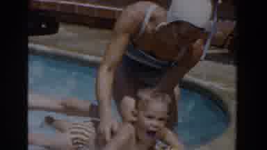 Van Nuys California (1962): Child Enjoying The Swimming Pool Guided By A Male And