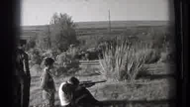 Washington (1939): People In A Deserted Field Practicing Shooting And A Man