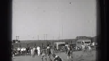 Washington (1939): Several Men Playing American Football Game In A Park With