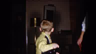North Hollywood California-1961: A Boy Plays With Toy Steering Wheel In Living Room