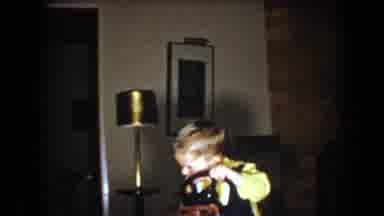 North Hollywood California (1961): A Boy Handles His Motor Toy In The Room