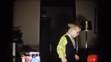 North Hollywood California (1961): Boy Wearing Green Shirt Looks At Red Yellow And