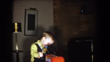 North Hollywood California (1961): Boy Messing Around In Families Living Room With