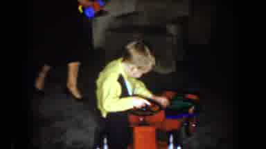 North Hollywood California (1961): A Woman And Her Son Play With A Toy On The