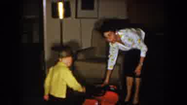 North Hollywood California (1961): Teaching Her Son How To Play The New Toy