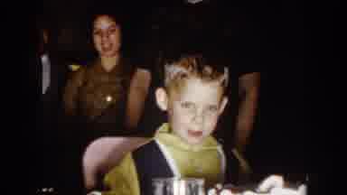 North Hollywood California (1961): Little Boy Sitting At A Table Being Handed A