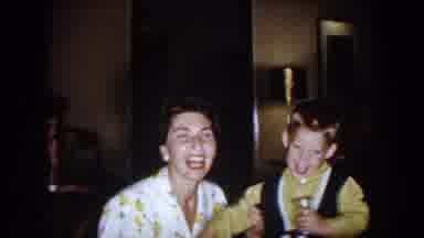 North Hollywood California (1961): Woman And Boy Talking And Laughing Indoors With