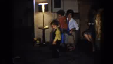 North Hollywood California (1961): Child Picks Up Food At Party While Women Chat