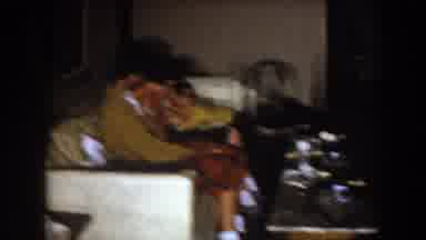 North Hollywood California (1961): Woman Wearing Red Dress Kisses Small Boy