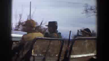 Lubbock Texas (1956): Several Men With Guns Sit And Wave From The Back Of A Pickup