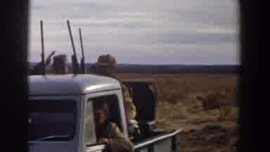Lubbock Texas (1956): Several Men And On Young Boy With Guns And A Dog Sit In The