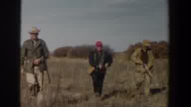 Lubbock Texas (1956): Three Alert Men Watching And Walking Through The Woods With