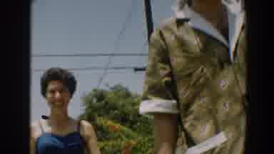 North Hollywood California-1961: Man and Woman Smiling on a Summer Day with a Boy