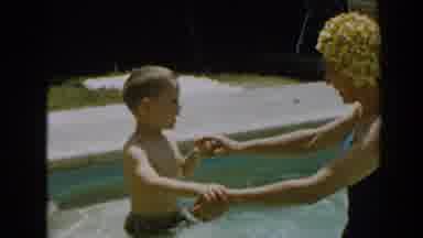North Hollywood California (1961): A Child Hesitates While He Goes Into A Swimming