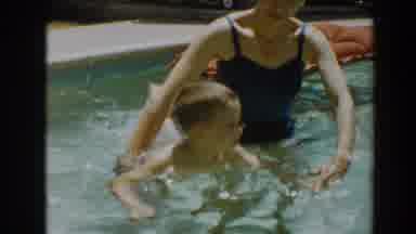 North Hollywood California (1961): Mother Helps Her Son Swim