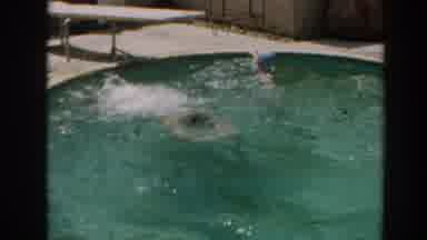 North Hollywood California (1961): A Man Dives Skillfully Into A Pool And Swims To