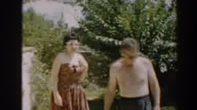 North Hollywood California (1961): A Bear-Chested Man And His Wife Walks Around
