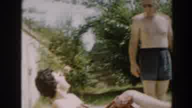 North Hollywood California (1961): A Bear-Chested Man Sun Bathing With His Wife At