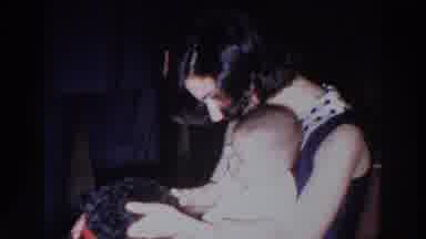 Madison Wisconsin (1966): Woman Wearing Black Dress Pets Black Dog While Holding