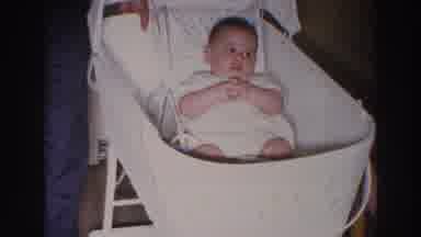 Madison Wisconsin (1966): A Baby In The Cradle Being Watched By Some Elders