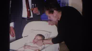 Madison Wisconsin (1966): Baby In Bassinet Getting Tickled By Woman With Man