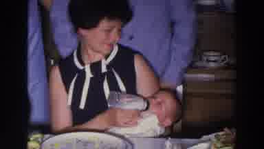 Madison Wisconsin (1966): Woman Feeds Formula To Her Infant Child At Happy Wedding