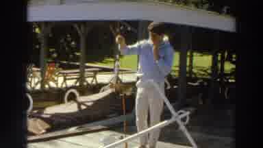 Madison Wisconsin (1966): Young Man In White Holding A Stick With A Fish Hanging