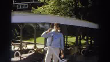 Madison Wisconsin (1966): Man Wearing Light Blue Shirt Smokes Cigarette While