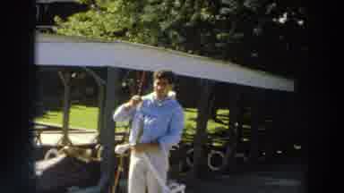 Madison Wisconsin (1966): Person Wearing Light Blue Sweater Holds Small Grey Fish