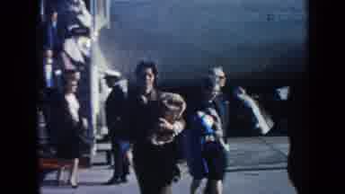 Arizona (1962): People Leaving Blue And White Pan American Plane On A Sunny Day