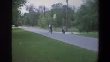 Minnesota (1973): Square I See Two Men Riding A Motorcycle Through A Square Full